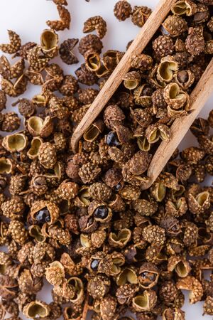 fragrant Sichuan pepper on white acrylic background.の写真素材