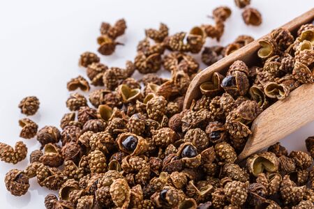 fragrant Sichuan pepper on white acrylic background.の写真素材