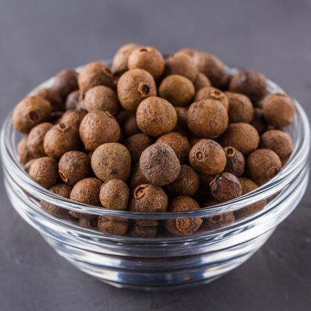 fresh spicy peppers on a dark stone backgroundの写真素材