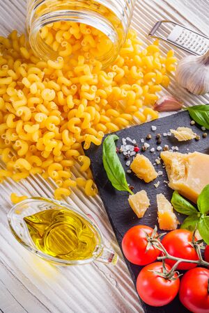 concept of traditional italian pasta with tomatoes and basil.の写真素材
