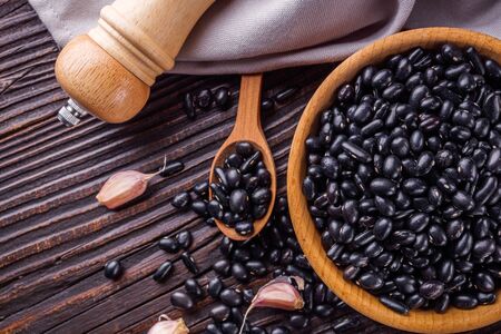 Fresh organic natural beans on wooden rustic background.