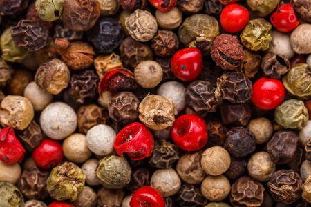 mix of peppercorns on white acrylic background.の写真素材