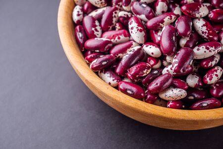 fresh organic natural beans on black background.の写真素材