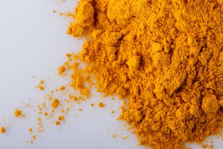 natural turmeric powder on white acrylic background.の写真素材
