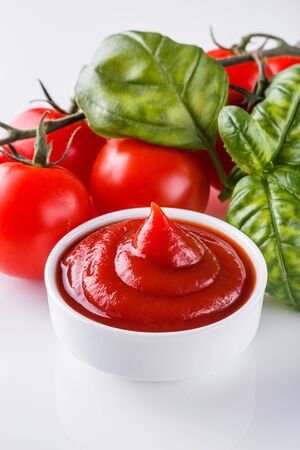 fresh natural tomato ketchup on a white background.の写真素材