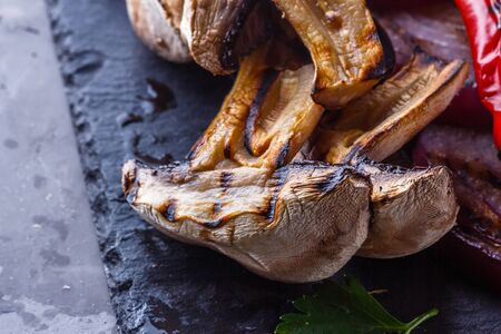 delicious fresh grilled vegetables on a stone plate.の写真素材
