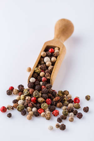 mix of peppercorns on white acrylic background.の写真素材