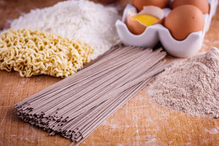 instant egg noodles on a wooden rustic background.の写真素材