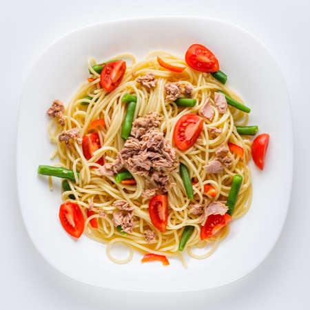 delicious traditional Italian pasta with tuna on a white background.の写真素材