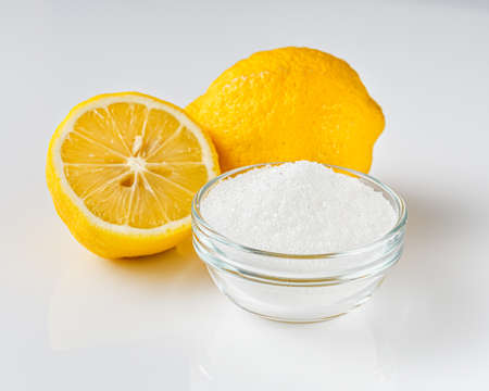 citric acid on a white acrylic background.の写真素材