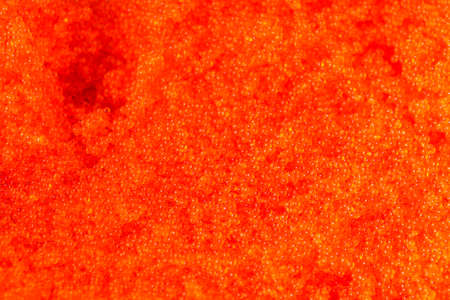 appetizing sushi roll california with cheese cucumber crab and masago caviar on a black stone plate.の写真素材