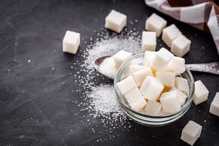 sugar refined on a dark stone background.