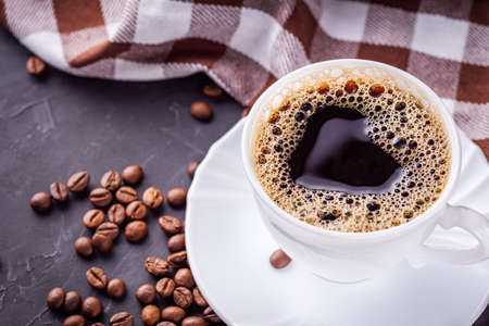 cup of fragrant fresh coffee on a dark stone background.の写真素材