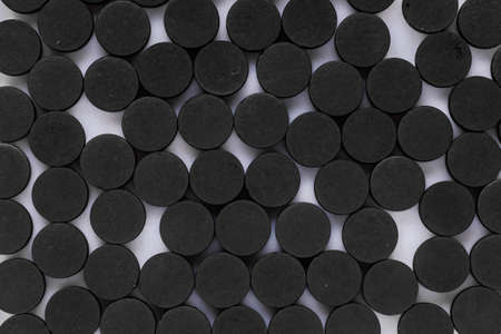 activated carbon on a white acrylic background.の写真素材