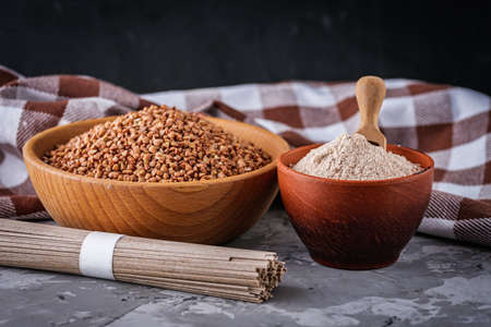 fresh natural buckwheat flour on a dark stone background culinary concept.の写真素材