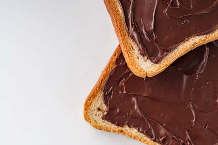 toasts with chocolate butter on a white acrylic background.の写真素材