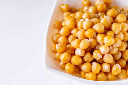 boiled chickpeas on a white acrylic background.の写真素材
