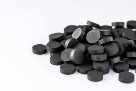 activated carbon on a white acrylic background.の写真素材
