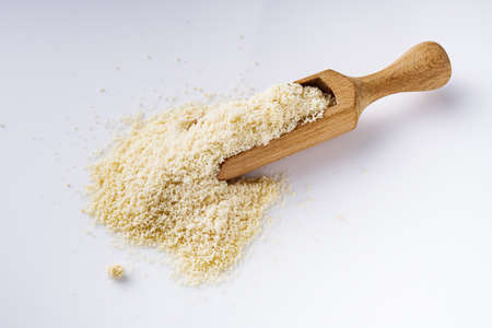 almond flour on a white acrylic background.