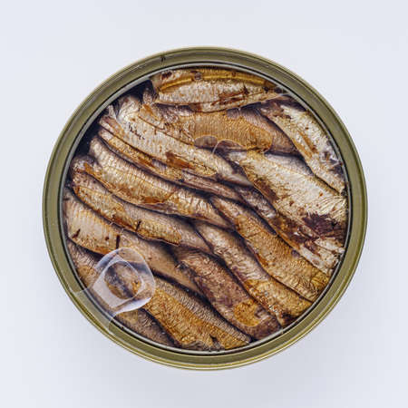 canned sprats in oil on a white background.の写真素材