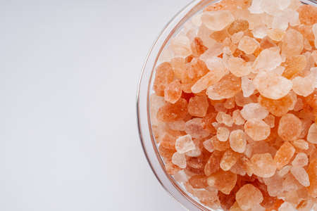 pink Himalayan salt on a white background.