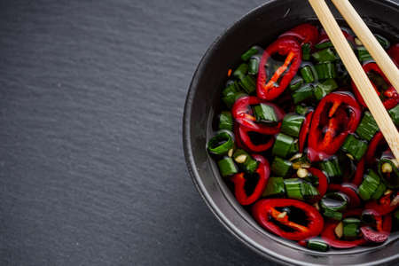 fragrant fish sauce on a black stone background.