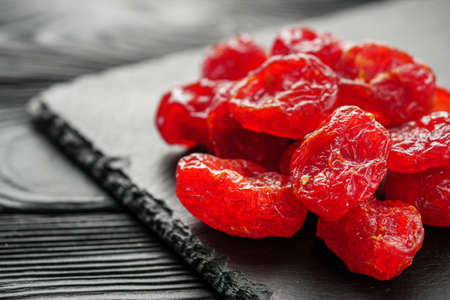 dogwood dried berry on a black rustic wooden background.の写真素材