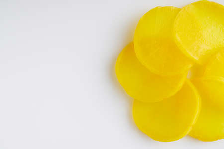 takuan traditional japanese marinated daikon radish on a white background.の写真素材