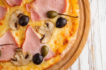delicious hot traditional italian pizza on a white wooden rustic background.の写真素材
