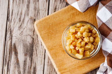 fried lard cracklings on a wooden rustic background.の写真素材