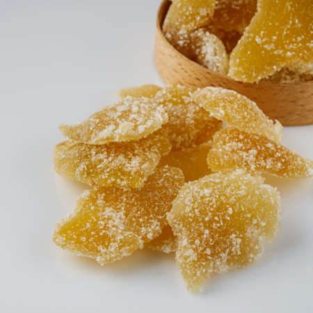 spicy dried ginger on a white acrylic background.の写真素材