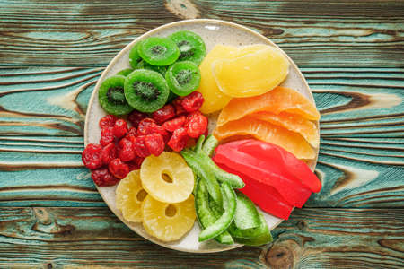 set of various dried fruits on a wooden rustic background.の写真素材