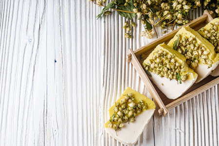 handmade soap on a white wooden rustic background.の写真素材