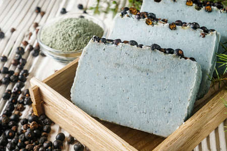 handmade soap on a white wooden rustic background.の写真素材