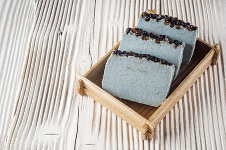 handmade soap on a white wooden rustic background.の写真素材
