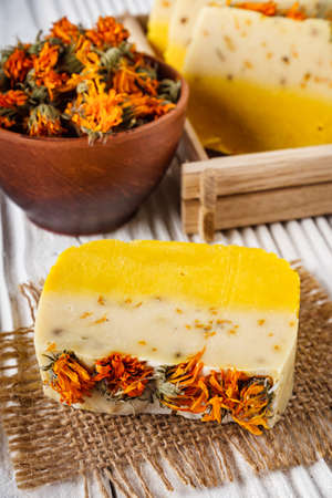 handmade soap on a white wooden rustic background.の写真素材