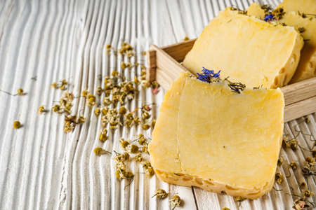 handmade soap on a white wooden rustic background.の写真素材