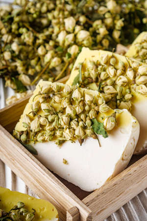 handmade soap on a white wooden rustic background.の写真素材
