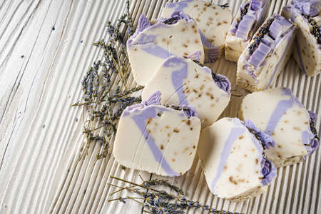 handmade soap on a white wooden rustic background.