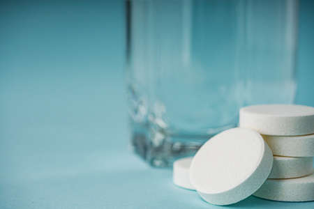 various medicines on a blue paper background.の写真素材