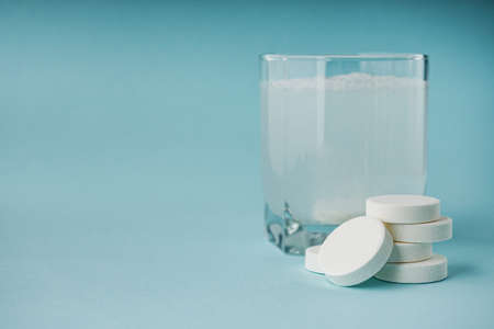 various medicines on a blue paper background.の写真素材