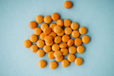 various medicines on a blue paper background.の写真素材