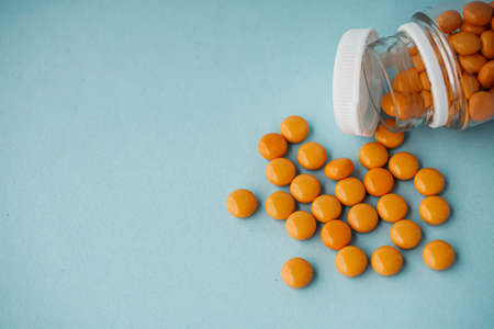 various medicines on a blue paper background.の写真素材