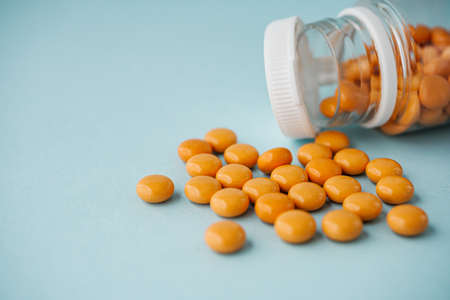 various medicines on a blue paper background.の写真素材