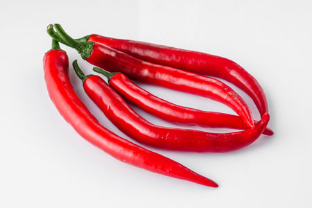hot chili peppers on a white background.の写真素材