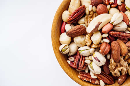 set of different nuts on a white acrylic background.の写真素材