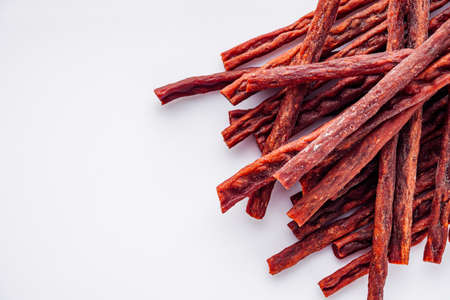 dried fish snack on a white acrylic background.の写真素材