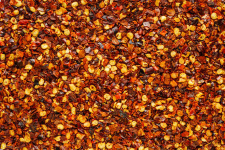 spicy chili flakes on a white background.の写真素材