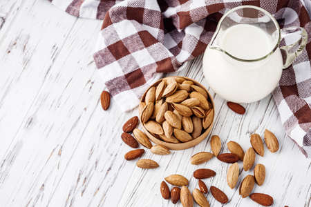 almond milk on a white wooden rustic background.の写真素材