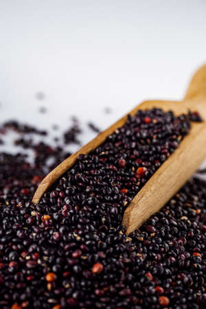 black quinoa seeds on a white acrylic background.の写真素材